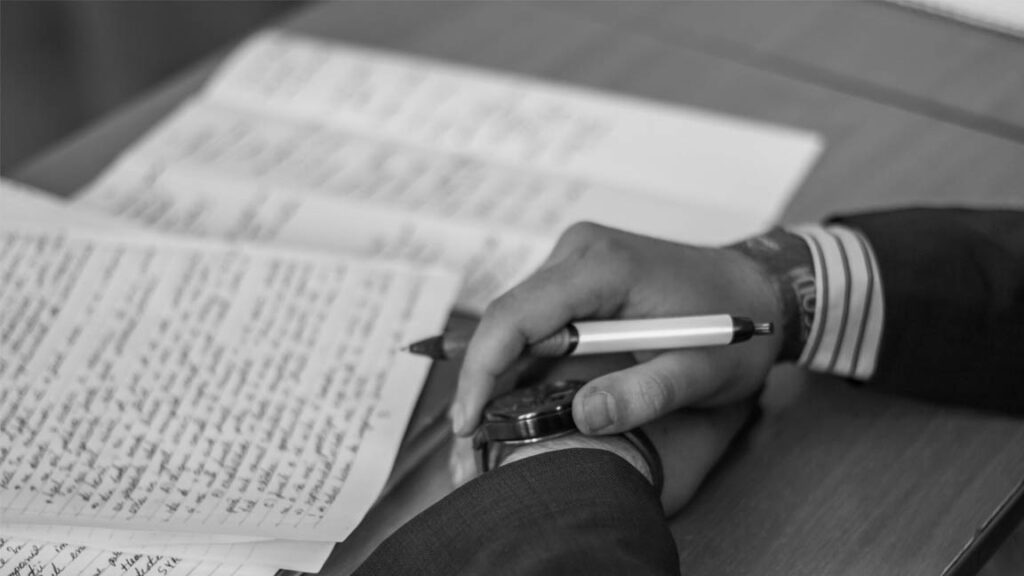 Student writing notes for CAT 2025 exam preparation