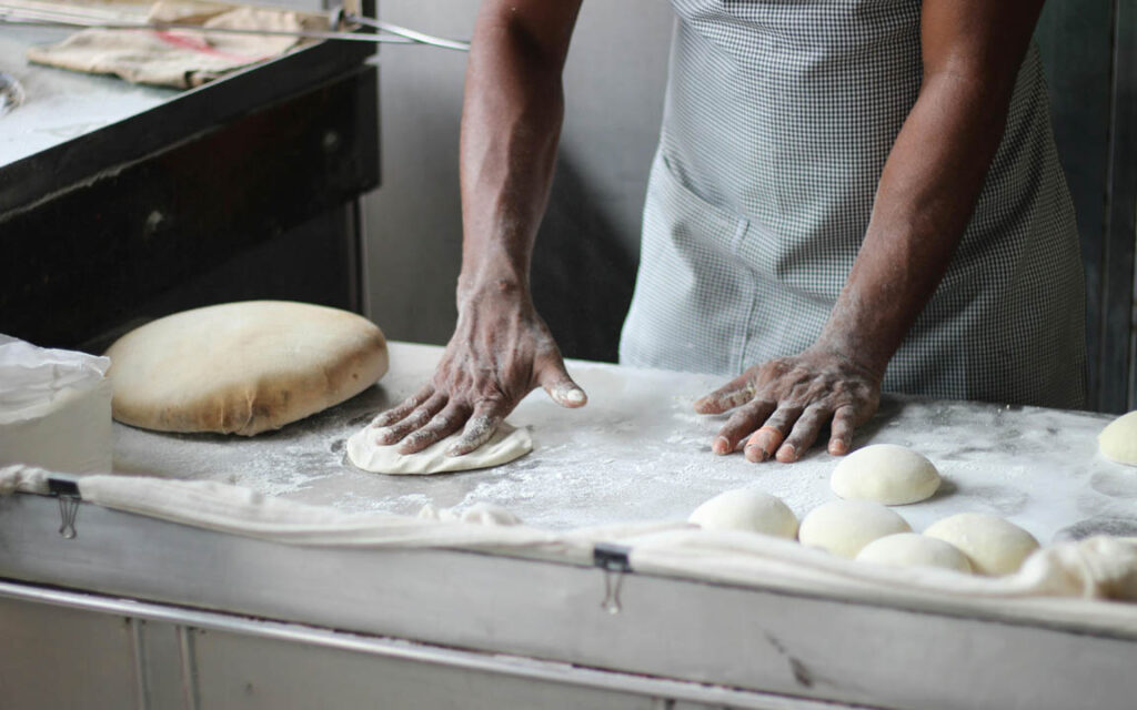 Baker kneading maida dough
