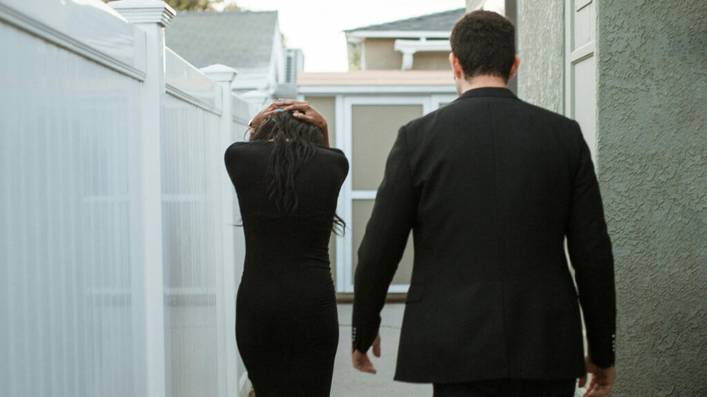 A woman walking away from a man, capturing the moment she decides to leave a Situationship.