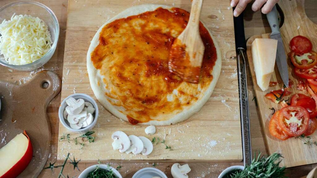 Is Maida Bad for Health – pizza dough with sauce and toppings